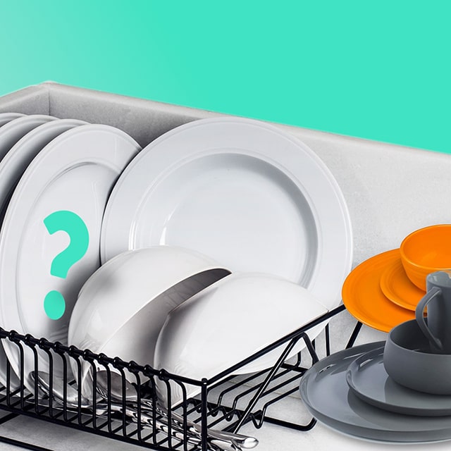 Different types of dishes are drying inside the sink.