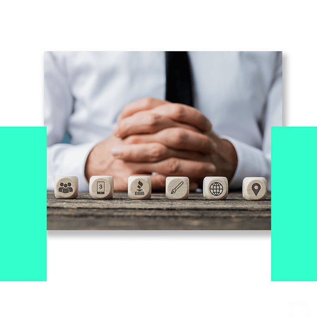 A man seats at the dark wooden table. His hands are on the desk and fingers are crossed. The man wears white shirt and black tie. at the front of his hands there are 6 dices. These dices have images on it that represents 6 tips on finding a reputable moving company and avoiding moving scams such as 1) ASK FOR REFERRALS FROM FRIENDS AND FAMILY, 2) GET AT LEAST 3 QUOTES, 3) CHECK THE BBB RATING OF EACH COMPANY, 4) RESEARCH THE COMPANY THOROUGHLY, 5) GET EVERYTHING IN WRITING, 6) KNOW YOUR RIGHTS AND RESPONSIBILITIES.