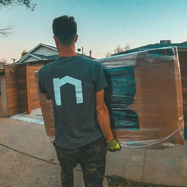 Next Moving professional local mover shows his knowledge of best moving tips and tricks, moving hacks, carrying properly wrapped TV
