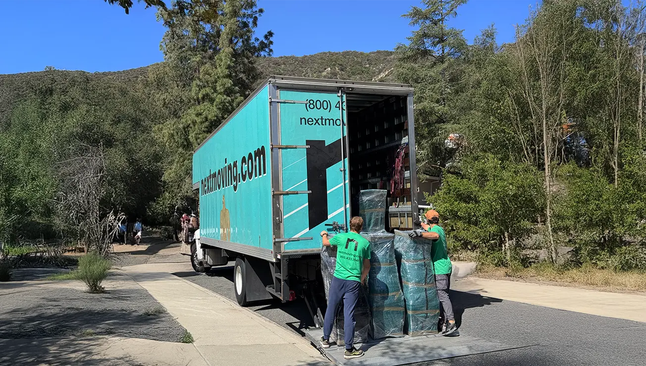 Professional moving crew loading truck - how much do movers cost guide